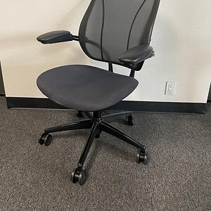 Humanscale Liberty task chair in black with ergonomic mesh backrest and adjustable armrests. Perfect.