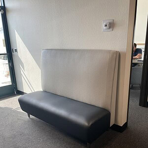 Gunlocke light grey and black lounge sofa for modern office spaces.