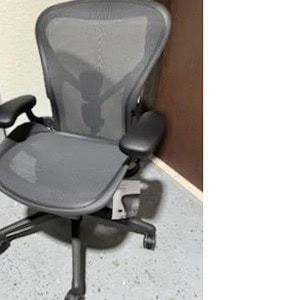 Quality Herman Miller Aeron Black ergonomic office chair for optimal comfort and support.