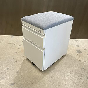 Herman Miller grey cushioned mobile pedestal with white finish, ideal for office storage and organiz.