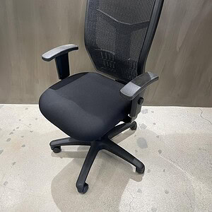 Ergonomic black mesh office chair with adjustable armrests and lumbar support. Perfect for comfortab.