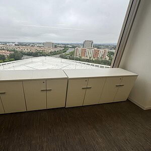 Credenza storage cabinet for office or commercial use, white finish, sleek design, ideal for organiz.