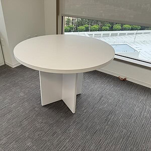 Napa white round table ideal for modern office or dining spaces. Durable, stylish, and perfect for v.