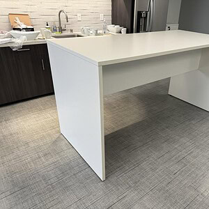White OFS Island table with clean lines, 78x36 inches, perfect for modern office or conference room.