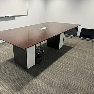 Mahogany top conference table with white base, ideal for office meetings and collaborative spaces.