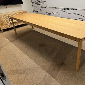Simple 10x3 ft wooden conference table for meetings and collaboration.