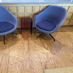 Royal blue lounge chairs with modern design in a professional office setting.