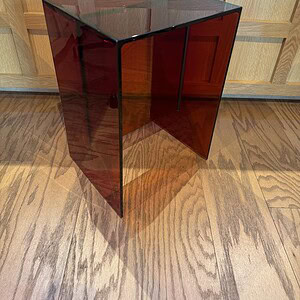 Red transparent designer table for modern interiors.