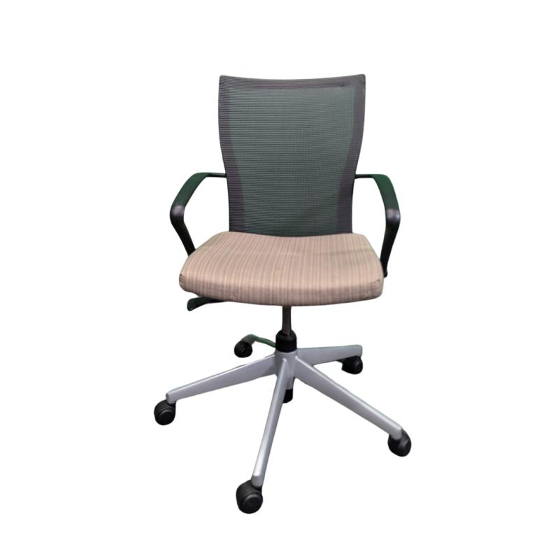Haworth x99 ergonomic task chair with mesh back and cushioned seat for office comfort.