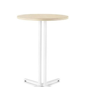 Modern Herman Miller Everywhere bar table with round wooden top and white base.