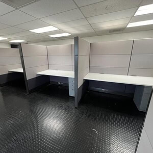 Refurbished black and silver Ethospace cubicles in an office setting.
