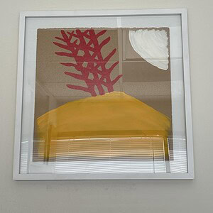 Bright red abstract plant artwork in pop art style on wall.