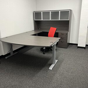Shaped executive desk with modern storage, ideal for professional office environments.