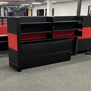 Storage and printer station with black and red finish at Cube World USA.