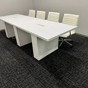 Conference table with Steelcase Payback 10x3 design in white finish.