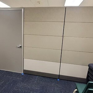 Ethospace Neutral 86in tall wall with silver door for office spaces.