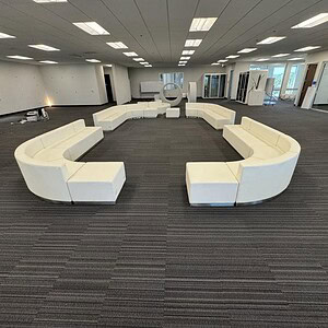 Modern Gunlocke Artic White modular lounge pieces in a spacious office setting.