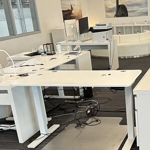 Autonomous height adjustable 52x29in desk for flexible workspace solutions.
