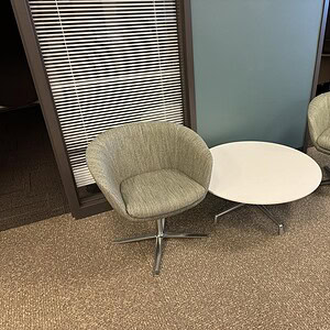 Modern lounge chair for office relaxation and meetings.