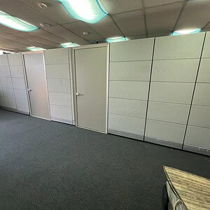 Acoustical Ethospace 86in Tall Neutral Silver wall panels for sound control and modern office design.