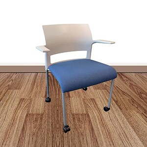 Modern Steelcase Move chair with blue seat and white backrest on casters.
