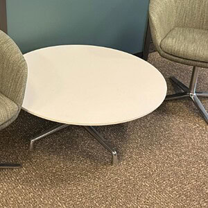 Round white Coalesse 66-inch occasional table for modern office or lounge spaces.