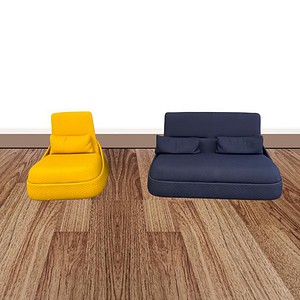 Blue and yellow lounge sofas in contemporary office space.