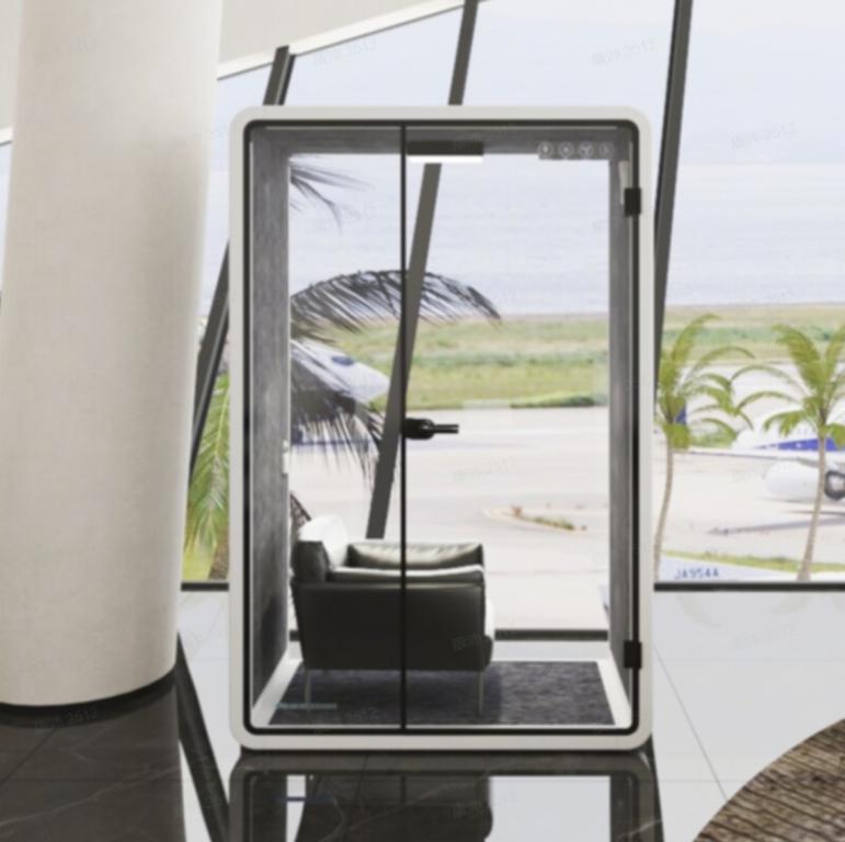 Privacy pod with glass walls and door for private work or relaxation. Compact, modern design ideal f.