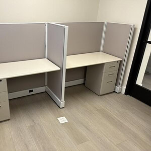 Refurbished Herman Miller A02 cubicles with beige desks and partitions.