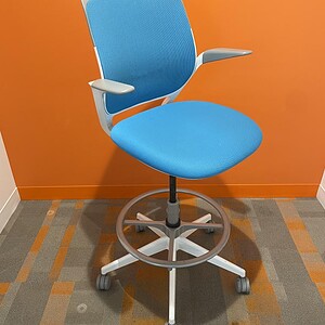 Blue Mesh Office Chair with Adjustable Armrests and Swivel Base.