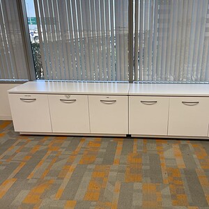 White storage credenza for office organization and storage solutions.