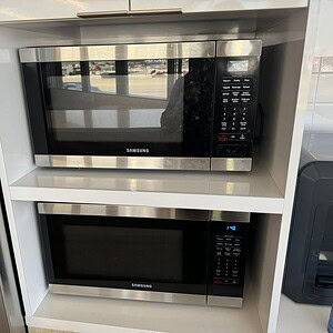 Samsung microwave oven for kitchen use with digital controls.