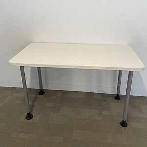 Quality Steelcase table with a white top and durable steel legs, ideal for office or conference room.