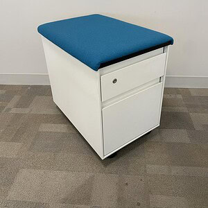 Steelcase white mobile pedestal with blue cushion for office storage and comfort.