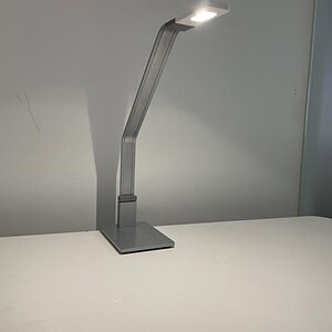 Steelcase Soto desk lamp with silver finish and LED lighting for modern workspace illumination.