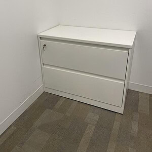 White Steelcase 2 drawer lateral file cabinet for office storage.