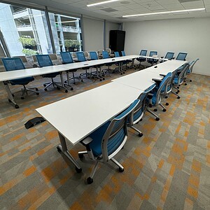 Nesting tables by Cube World USA arranged in a spacious, well-lit conference room.
