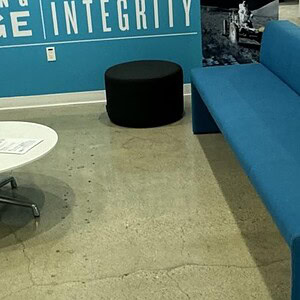 Modern lounge with colorful seating and a white coffee table at Cube World USA.