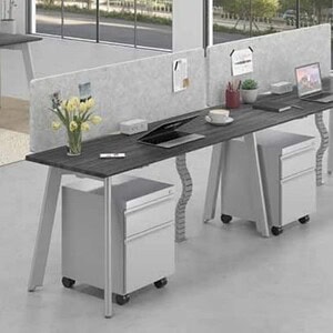 Modern office desk with dual workstations and privacy panels for productivity.
