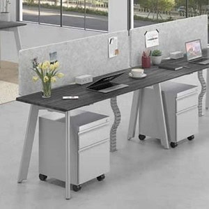 Modern office workspace with 3-person 30" deep single-sided ENGAGE divider.