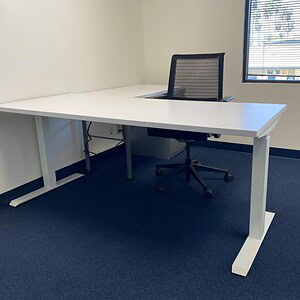 Adjustable height desk with pedestal, perfect for ergonomic workspace setup. Modern design ideal for.