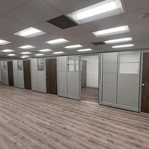 Office cubicles with Herman Miller Ethospace Silver Birch panels.