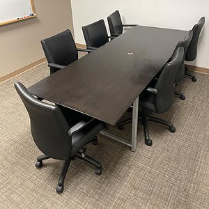 Dark Espresso conference table for meetings and collaboration.