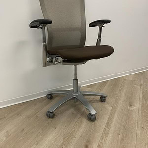 Knoll Life mesh back office chair with espresso seat and adjustable armrests.