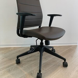 Office chair with espresso brown leather upholstery and adjustable height.
