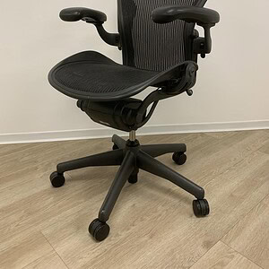 Herman Miller Aeron B office chair without lumbar support, ergonomic design.
