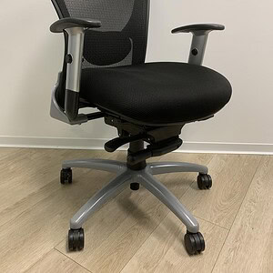 Ergonomic black mesh office chair with adjustable armrests and lumbar support.