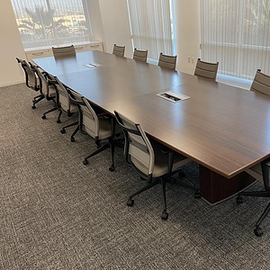 Conference table in espresso finish for professional meeting rooms.