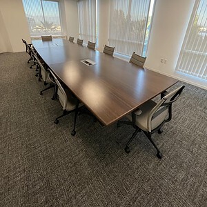Conference table with espresso finish, ideal for meetings and collaborative workspaces.