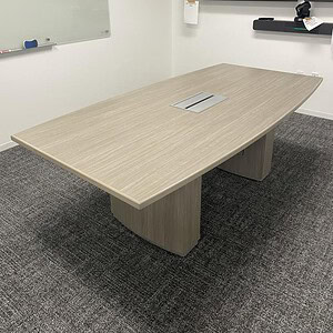 Conference table with Driftwood finish for meetings and collaboration.